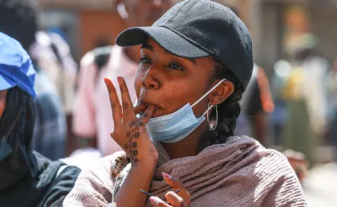 Getty Images A woman whistles during an anti-coup protest in Khartoum, Sudan - Tuesday 8 March 2022