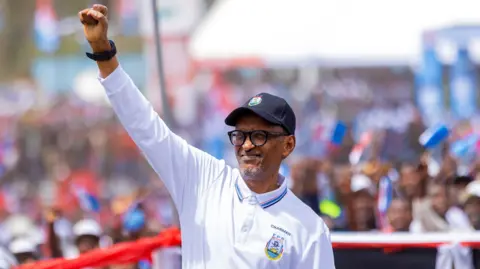 EPA Incumbent President of Rwanda Paul Kagame waves to supporters during the launch of his presidential campaign in Musanze, Rwanda.
