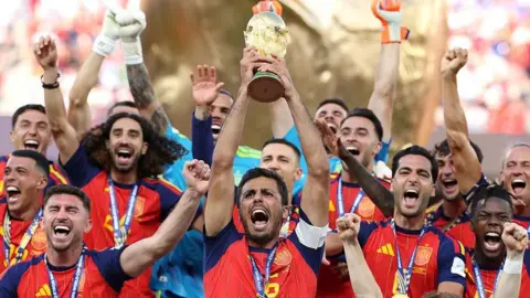 Rodri lifts the World Cup trophy after Spain beat Argentina in the 2026 final 