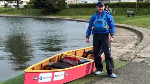 Ingenium Photography Martin Malone next to the canoe at Mooragh Park Lake