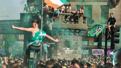 Getty Images hundreds of celtic fans partying in the street