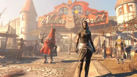 Bethesda Screenshot from Fallout 4 shows a masked raider character standing in front of a sketchy looking theme park with a "Nuka-World" sign over the entrance. To their left, a sinister red mascot character modelled on a bottle of Nuka Cola - the Fallout series' signature drink - waves at the viewer.