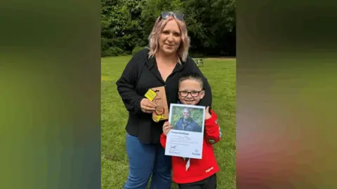 Anna O'Connor and her son Conor Tuohy stand together. 