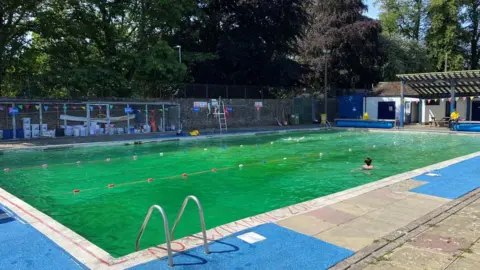 A woman swims in the pool