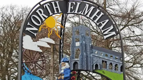 Adrian S Pye/Geograph North Elmham village sign