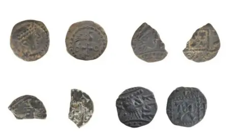 Oxfordshire County Council Two rows with eight of the 21 silver pennies, some are fragmented.