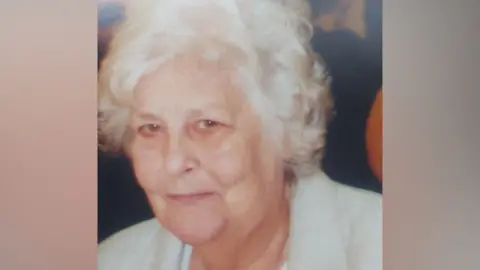 Supplied Family photograph of Margaret Welsh. She has grey hair and is wearing a light-coloured jacket.