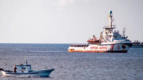 AFP A Spanish migrant rescue boat waits off the coast of the Italian island of Lampedusa on August 17, 2019