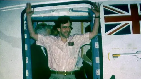 BBC/Overs John McCarthy arrives in the UK in 1991 after being held hostage in Lebanon for five years