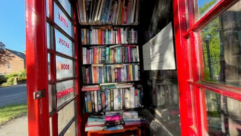 Little Eaton phone box with books inside