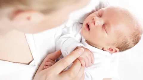 Getty Images Mum with baby