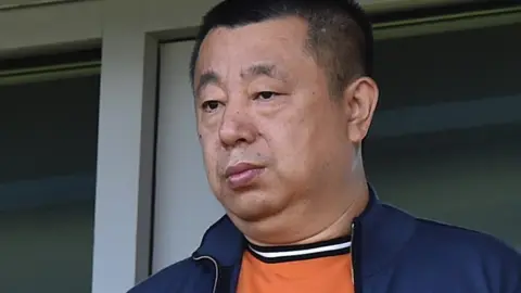 Rex Features Reading owner Dai Yongge watches a game