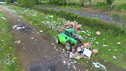 PA MEDIA Rubbish being cleared in a field at the end of the Appleby Horse Fair, the annual gathering of the travelling community in Appleby, Cumbria.