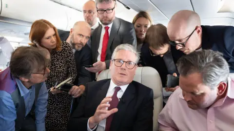 PA Keir Starmer on the plane to Washington DC, taking questions from journalists