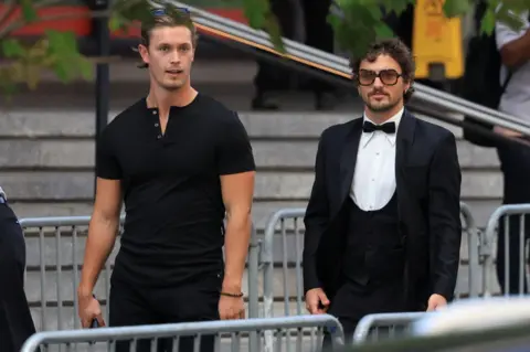 Getty Images US singer Benson Boone, right, arrives at Madison Square Garden