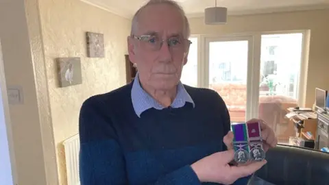 BBC Richard Lee with his medals