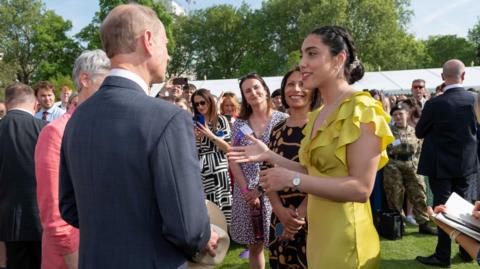 Image of Lauren Bennett talking to the Duke of Edinburgh, Prince Edward, and Ruth Marvel