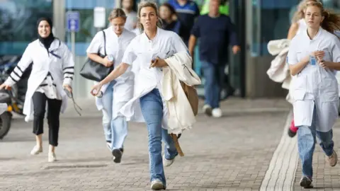 EPA Stuff running out of Rotterdam's Erasmus Medical Center. Photo: 28 September 2023