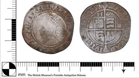 Derbyshire Coroner's Office A silver coin with a white background