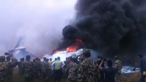 Bishnu Sapkota Wreckage of the plane at Kathmandu airport, Nepal, 12 March 2018