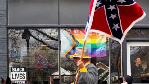 Getty Images Confederate re-enactors and supporters march in Lexington, Virginia, during Lee-Jackson Day celebrations in January 2024