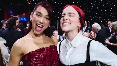 Getty Images Dua Lipa and Billie Eilish attend the 29th Annual Critics Choice Awards at Barker Hangar on January 14, 2024