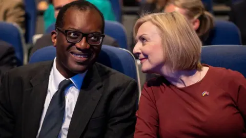 EPA British Prime Minister Liz Truss and former Chancellor Kwarteng at the opening session of Conservative Party Conference