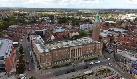 Shaun Whitmore/BBC Aerial image showing Norwich City Hall and surrounding buildings, including its clock tower to the right