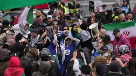 Protesters take part in the annual protest rally by pro-Palestinian group Al Quds, in central London