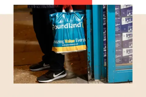 Bloomberg via Getty Images A shopper holds a Poundland shopping bag