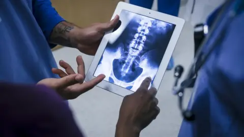 Getty Images doctors looking at a scan