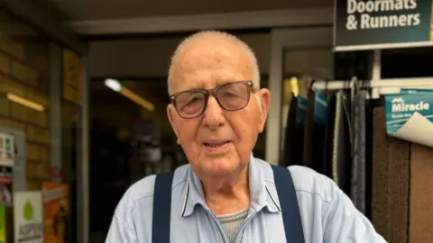 Zoie O'Brien/BBC A head and shoulders image of an older man who is wearing glasses and looking into the camera.