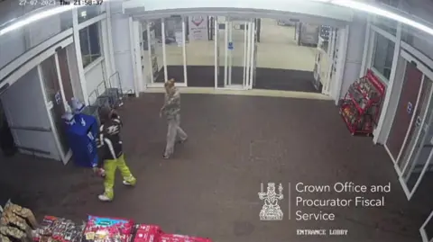 COPFS A couple in the entrance to a supermarket