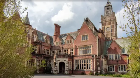 Trevor Bishenden Aldermaston Manor in Berkshire is a Grade II listed early Victorian building. It has red bricks and stone mullens round the windows and doors.