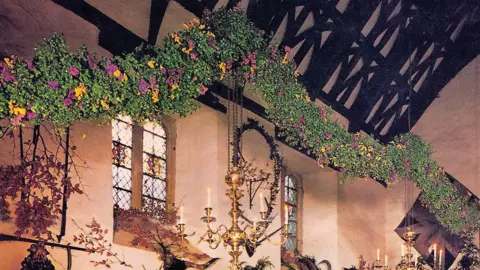 The National Trust Cotehele Archive photo of the garland in the 1980s