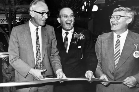 Mirrorpix/Getty Images A 1986 tape-cutting ceremony with Environment Secretary Nicholas Ridley, Sir John Hall and Councillor George Gill