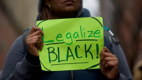 Getty Images protester holds a sign