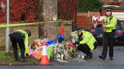 PA Police place flowers at the crash site