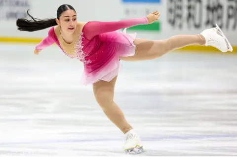 Lintao Zhang/Getty Images Woman skating on ice, 25 August