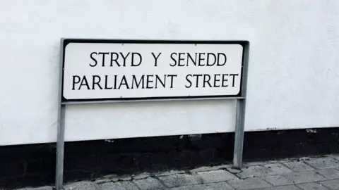 Amaly A sign reading Stryd y Senedd... Parliament Street