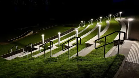 Sam Hey Concrete terraced seating lit up at night