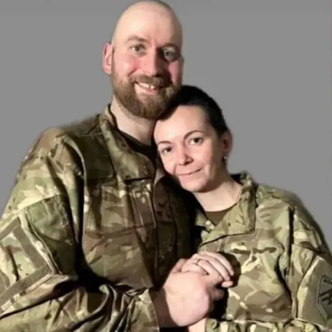 Dmytro Kozatsky Andriy and Valeria in military uniform