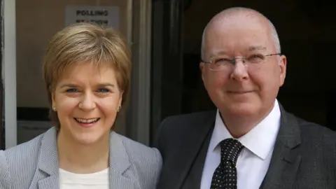 PA Media Nicola Sturgeon and Peter Murrell smiling in June 2016
