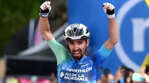 Decathlon AG2R La Mondiale Team's Valentin Paret-Peintre celebrates as he crosses the finish line to win stage 10
