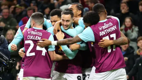 Josh Brownhill of Burnley celebrates scoring his team's second goal with teammates during the Championship match between Burnley FC and Sheffield Wednesday FC at Turf Moor