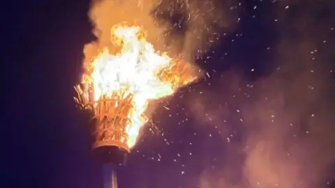 A beacon has been set on fire at night