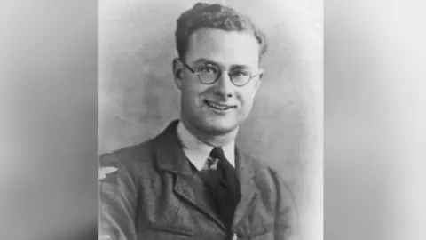 Royal Air Force A black and white photo of a young man with glasses and short, curly hair wearing an RAF uniform - shirt, tie and jacket.