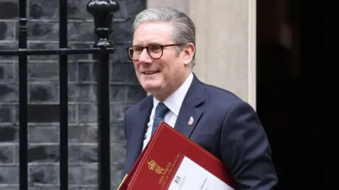 Keir Starmer leaves Downing Street with his Prime Ministers red folder. 