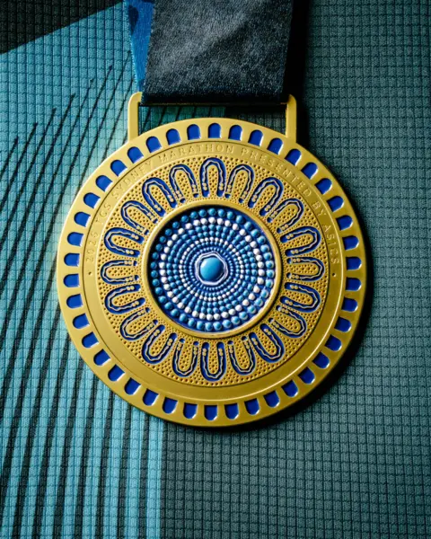 Instagram: sydney_marathon Front of the Sydney Marathon medal.