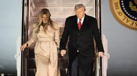 PA Media US President Donald Trump and First Lady Melania Trump step off Air Force One as they arrive at Stansted Airport on Tuesday 16 September, ahead of the US President's second state visit to the UK. 